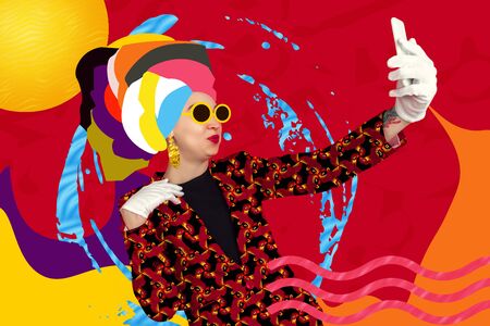 Summers selfie. Portrait of a young woman with freaky appearance, look and bright colorful painted...