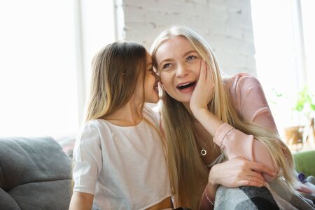 Mother and daughter, sisters have quite, beauty and fun day together at home. Comfort and togetherness. Concept of childhood, happiness, familys weekend, friendship, pajamas party. Domestic lifestyle.の写真素材