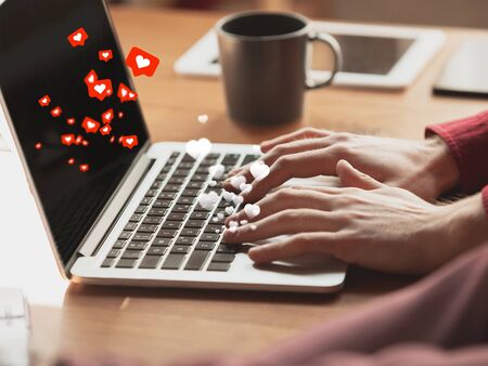 Male hands typing text, message and sharing with social media, using laptop. Get comments, likes....