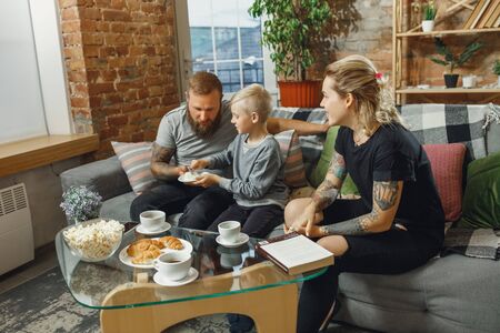 Best day. Happy family at home spending time together. Having fun, look cheerful and lovely. Mother,...