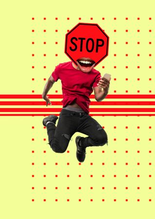 Jumping man headed by sign STOP. Take a breath before winning. Modern design. Contemporary artwork, collage with traffic signs and its new senses. Concept of fashion, business, self-development.の写真素材