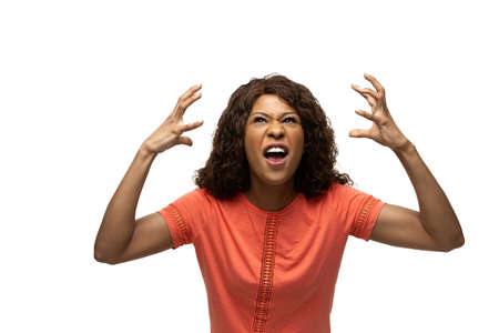 WTF. Young african-american woman with funny, unusual popular emotions and gestures on white studio background. Human emotions, facial expression, sales, ad concept. Trendy look inspired by memes.の写真素材