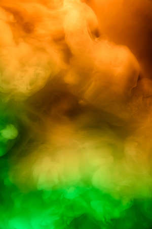 Abstract colorful, multicolored smoke spreading, bright background for advertising or design, wallpaper for gadget. Neon lighted smoke texture, blowing clouds. Modern designed.の写真素材