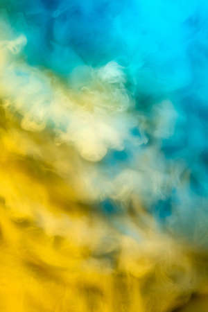 Abstract colorful, multicolored smoke spreading, bright background for advertising or design, wallpaper for gadget. Neon lighted smoke texture, blowing clouds. Modern designed.の写真素材