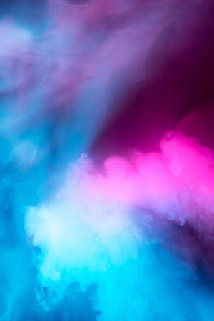 Abstract colorful, multicolored smoke spreading, bright background for advertising or design, wallpaper for gadget. Neon lighted smoke texture, blowing clouds. Modern designed.の写真素材