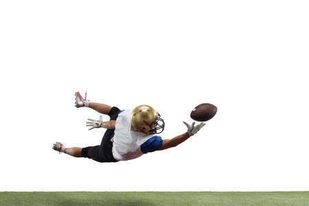 In jump, flight. American football player isolated on white studio background with copyspace. Professional sportsman during game playing in action and motion. Concept of sport, movement, achievements.の写真素材