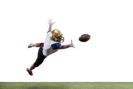In jump, flight. American football player isolated on white studio background with copyspace. Professional sportsman during game playing in action and motion. Concept of sport, movement, achievements.の写真素材