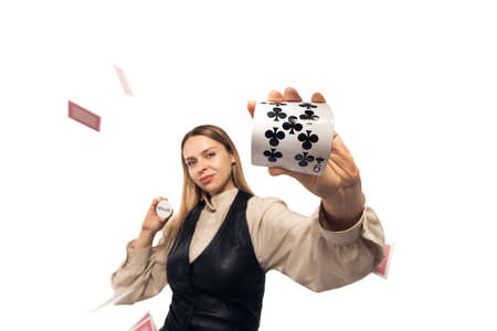 Poker girl. Young woman, croupier gesturing isolated on white background. Highly tensioned, wide angle, fish eye view. Concept of human emotions, facial expression, sales, ad, sport, gambling.の写真素材