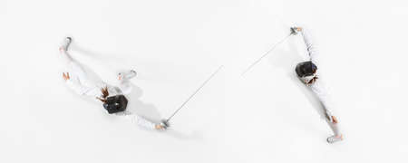 First. Teen girl in fencing costume with sword in hand on white background. Top view. Young female...