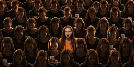 Top view of grey crowd of identical people and special one woman, difference and diversity concept....