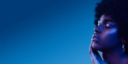 Ocean blue. Beautiful face of young woman with clean and fresh skin. Flyer with copyspace for ad....