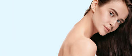 Softness. Beautiful face of young woman with clean and fresh skin. Flyer with copyspace for ad....