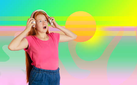 Shocked wearing headphones. Caucasian teens girl portrait. Beautiful female model in casual. Concept...