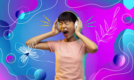 Listening to music, screaming. Asian young womans portrait. Female model in casual. Concept of human...