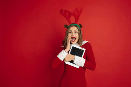 Showing blank tablet screen. Concept of Christmas, 2021 New Years, winter mood, holidays. Copyspace...