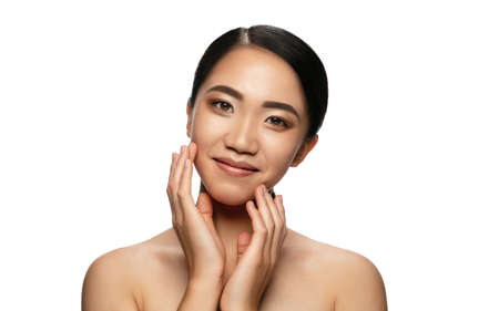 Confidence. Portrait of beautiful asian woman isolated on white studio background. Beauty, fashion, skincare, cosmetics concept. Well-kept skin and fresh look. Healthy, shiny. Copyspace for ad.の写真素材