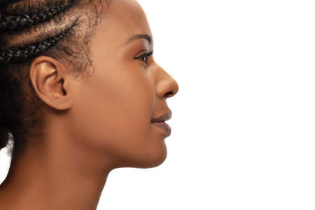 Profile. Portrait of beautiful african-american woman isolated on white studio background. Beauty,...