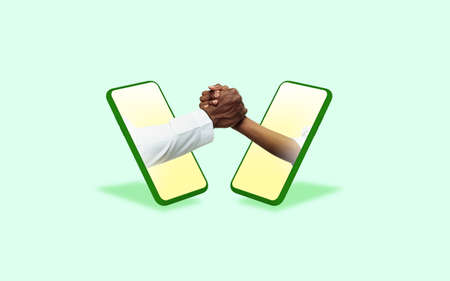 Greeting. Hands gesturing through screens of mobile phones against green background. Concept of...