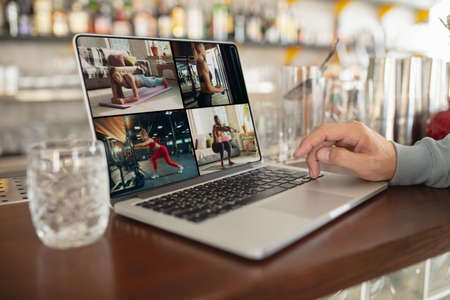 Online sport coaching, training. Close up screen with streaming. Workplace anywhere you go with PC, devices and gadgets. Concept of distance learning, isolation, business, shopping online, conference.の写真素材