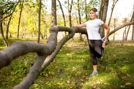 Confidence. Disabled woman walking down and training outdoors in forest, practicing. Active woman...
