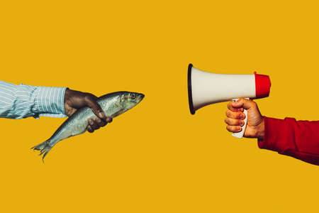 Fish talking. Modern art collage in pop-art style. Hands isolated on trendy colored background with...
