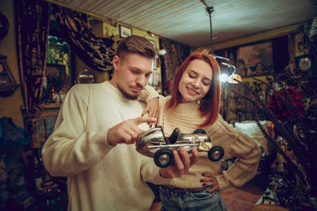 Car. Smiling family, caucasian couple looking for home decoration and holidays gifts in household...