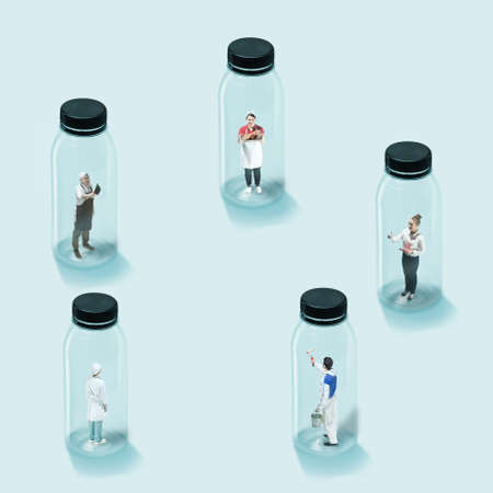 Concept of social distance during coronavirus wolrdwide pandemic, safety in work and daily routine. Young workers closed into glass bottles so virus wont let in. Healthcare, medicine, artwork.の写真素材