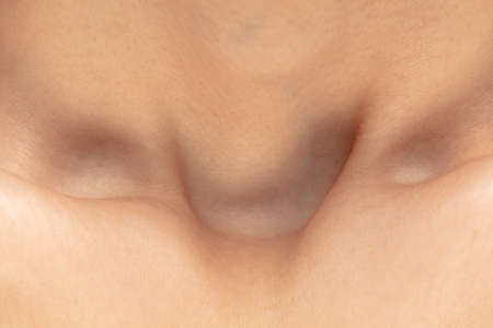 Collarbones. Close up portrait of beautiful jewish female model. Parts of face and body. Beauty,...