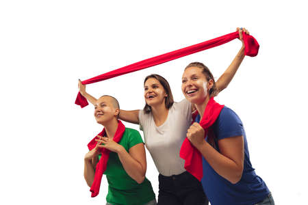 Win. Female soccer fans cheering for favourite team with bright emotions isolated on white studio...