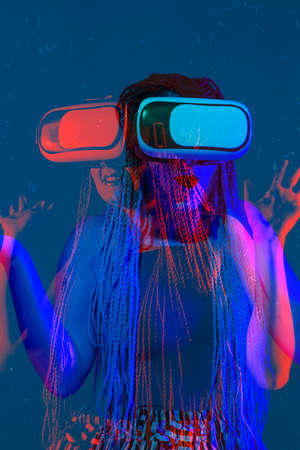 Close up portrait of caucasian woman using devices, gadgets on studio background. Modern and trendy...
