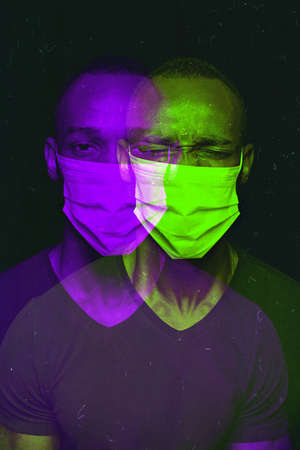 Close up portrait of african man wearing face mask background. Modern and trendy duotone effect, double exposure. Concept of human emotions, facial expression. Copyspace for adv. People in halftones.の写真素材