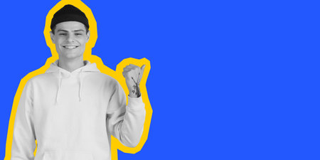 Pointing. Young Caucasian mans portrait isolated on blue studio background. Collage in magazine...