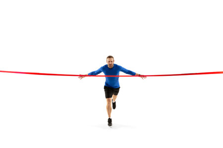 Caucasian professional jogger, runner training isolated on white studio background. Muscular,...