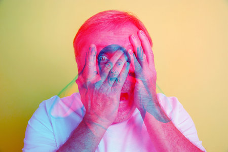 Scared. Multiple portrait with glitch duotone effect. Multiple exposure, abstract fashionable beauty photo. Senior beautiful male model posing. Youth culture, composite image, fashionable people.の写真素材