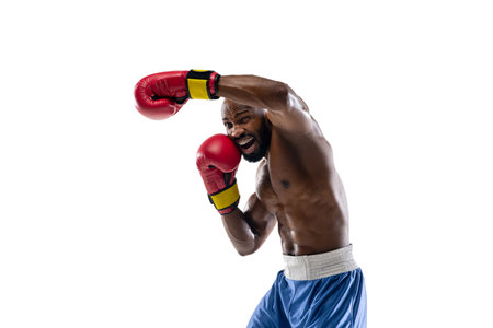 Attacking. Funny, bright emotions of professional african-american boxer isolated on white studio background. Excitement in game, human emotions, facial expression and passion with sport concept.の写真素材