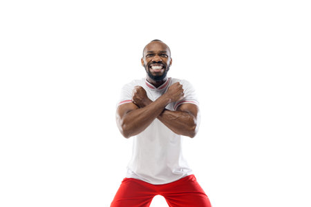 Highly tensioned game. Funny emotions of professional football, soccer player isolated on white...