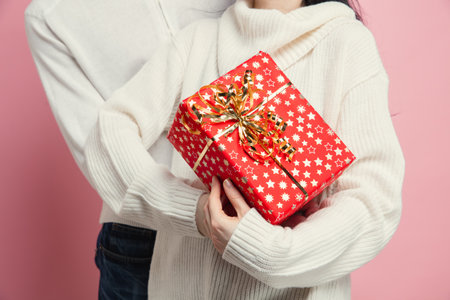 Close up beautiful couple in love on pink studio background. Saint Valentines Day, love,...