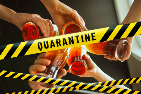 Close up hands clinking glasses with beer bounding tapes Lockdown, Coronavirus, Quarantine, Warning - closing bars, restaurants and nightclubs during pandemic. Lowed social life, ban of group meeting.の写真素材