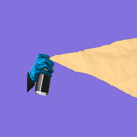 Color change. Hand spraying yellow triangle on blue background. Negative space to insert your text. Modern design. Contemporary colorful and conceptual bright art collage, art collage. Visual art.の写真素材