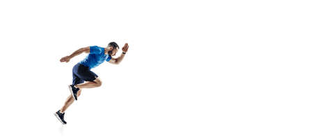 Flying. Caucasian professional male athlete, runner training isolated on white studio background....