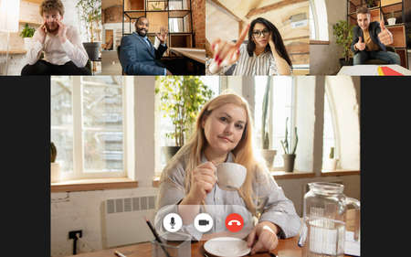 Team working by group video call share ideas brainstorming use video conference. PC screen view with young people, application ad. Easy and comfortable usage concept, business, online, finance.の写真素材