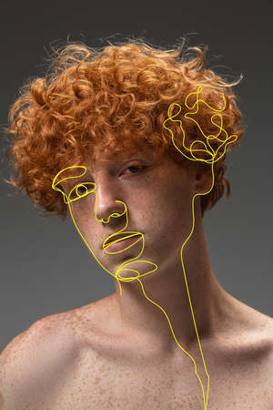 Art portrait of young man, fashion model with abstract geometrical drawings by modern one line style technique. Contemporary art, beauty, colors, glamour, inspiration. New look of paintography.の写真素材