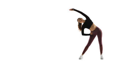 Flyer. Young caucasian female model in action, motion isolated on white background with copyspace....