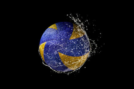 Volleyball ball flying in water drops and splashes isolated on black backgroundの写真素材