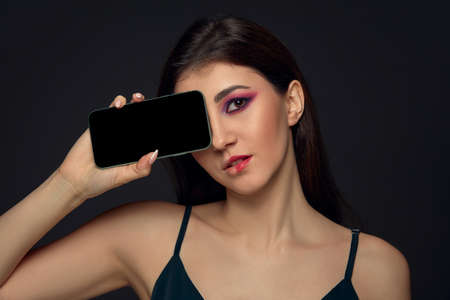 Lie and another life in social media. Girl with make up only on half of her face. Playing pretend....