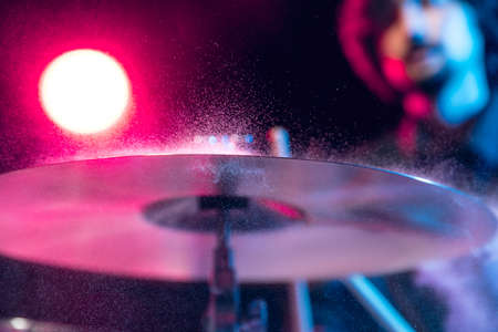 Drummers rehearsing on drums before rock concert. Man recording music on drumset in studioの写真素材