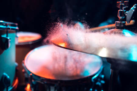 Drummers rehearsing on drums before rock concert. Man recording music on drumset in studioの写真素材