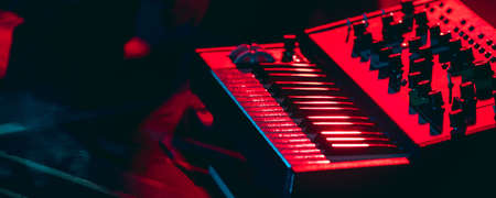 Close-up of musicial equipment for performing in neon light. Concept of advertising, hobby, music,...