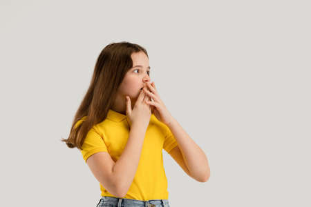 Caucasian girl isolated on white studio background. Copyspace. Childhood, education, emotions conceptの写真素材