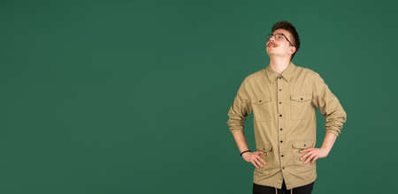 Caucasian mans portrait isolated over green studio background with copyspace